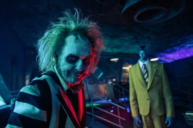 Michael Keaton and friend in 'Beetlejuice Beetlejuice.' - Credit: Parisa Taghizadeh/Warner Bros