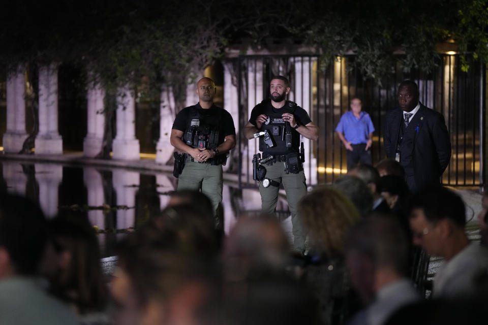 Security guards stand watch during an event commemorating Kristallnacht, the 1938 government-backed pogroms against Jews in Germany and Austria, at the Holocaust Memorial in Miami Beach, Fla., Sunday, Nov. 5, 2023. (AP Photo/Rebecca Blackwell)