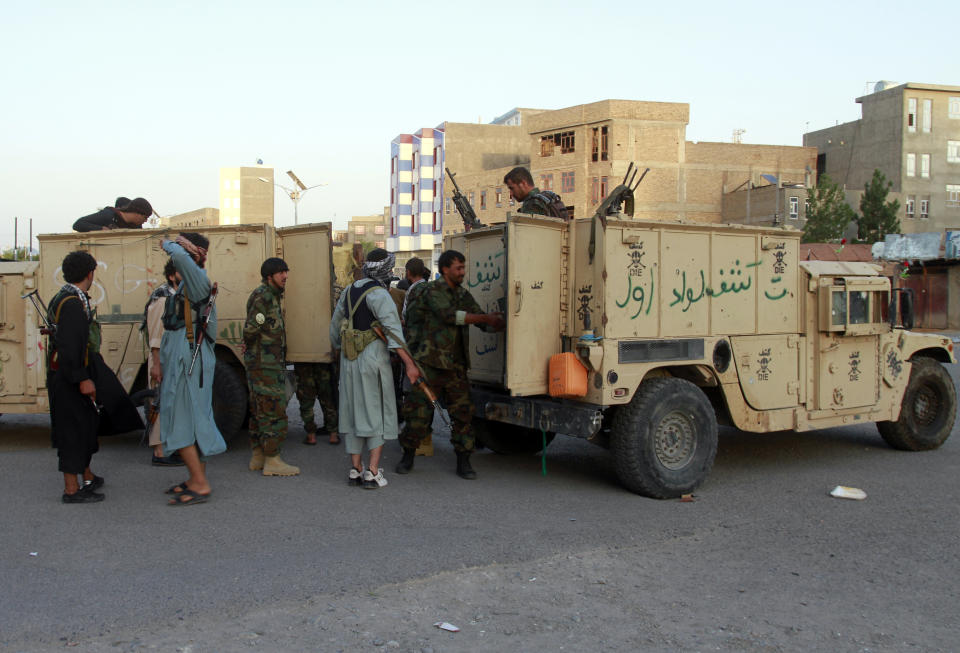 Private militia loyal to Ismail Khan, the former Mujahideen commander, patrols after security forces took back control of parts of Herat city following fighting between Taliban and Afghan security forces in Herat province, west of Kabul, Afghanistan, Friday, Aug. 6, 2021. (AP Photo/Hamed Sarfarazi)