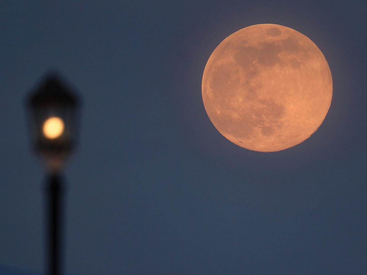  A supermoon rises over Worthing pier on 7 April, 2020 in Worthing, United Kingdom (Getty Images)