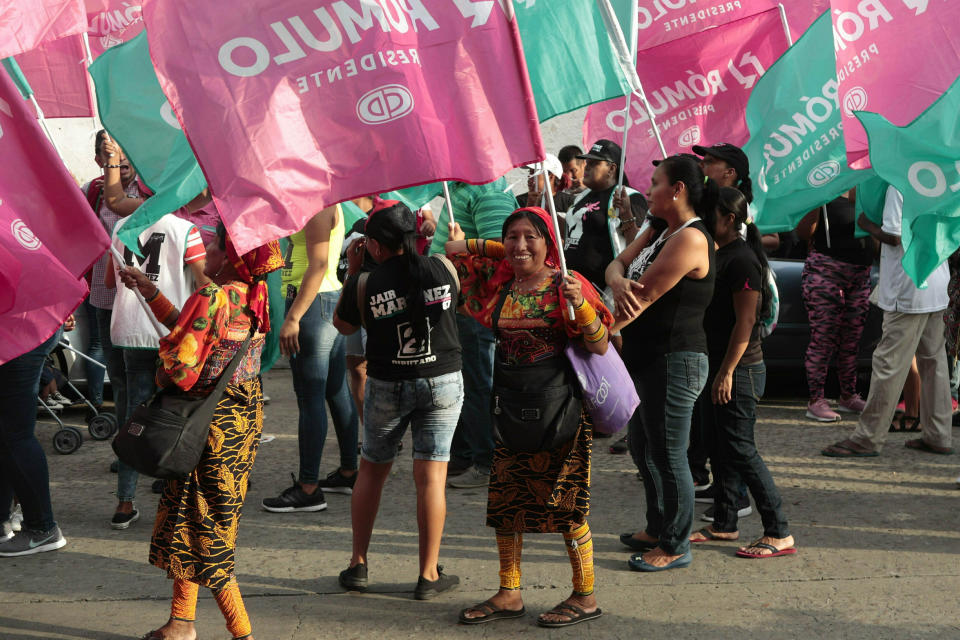 Supporters of Panamanian presidential candidate Romulo Roux, holding Democratic Change party banners, attend his closing campaign rally in Panama City, Thursday, May 2, 2019. In what has been perhaps the shortest and least colorful campaign since Panama's transition to democracy three decades ago, most election talk has focused on governmental corruption. (AP Photo/Arnulfo Franco)