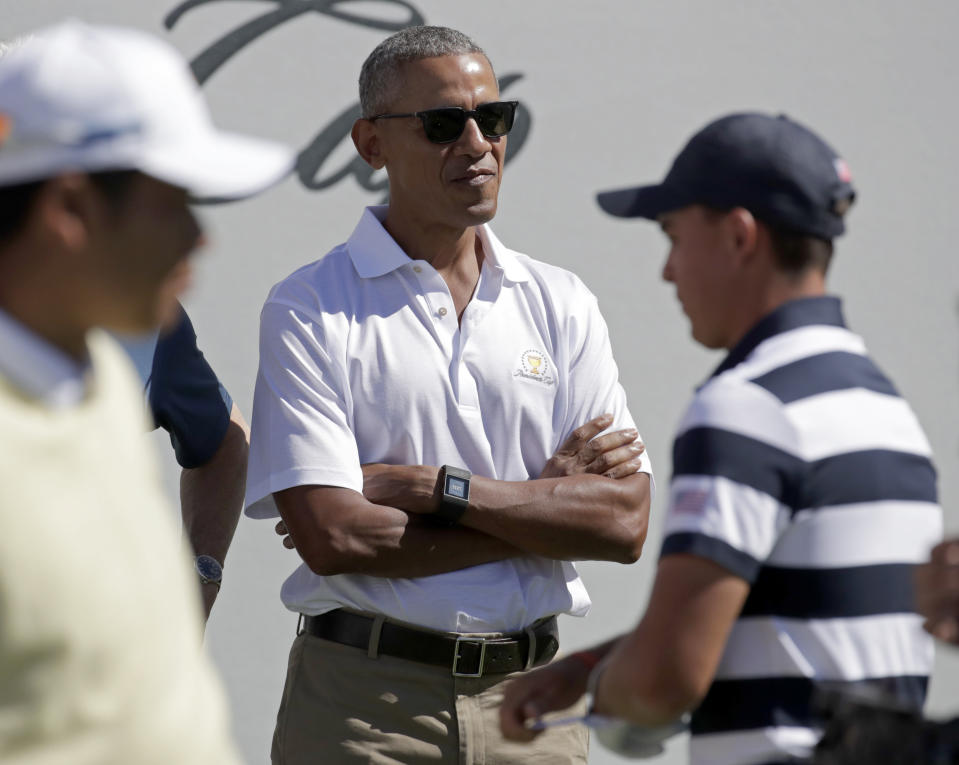 <p>Former President Barack Obama looks on from the first tee before the first round of the Presidents Cup at Liberty National Golf Club in Jersey City, N.J., Thursday, Sept. 28, 2017. (AP Photo/Julio Cortez) </p>