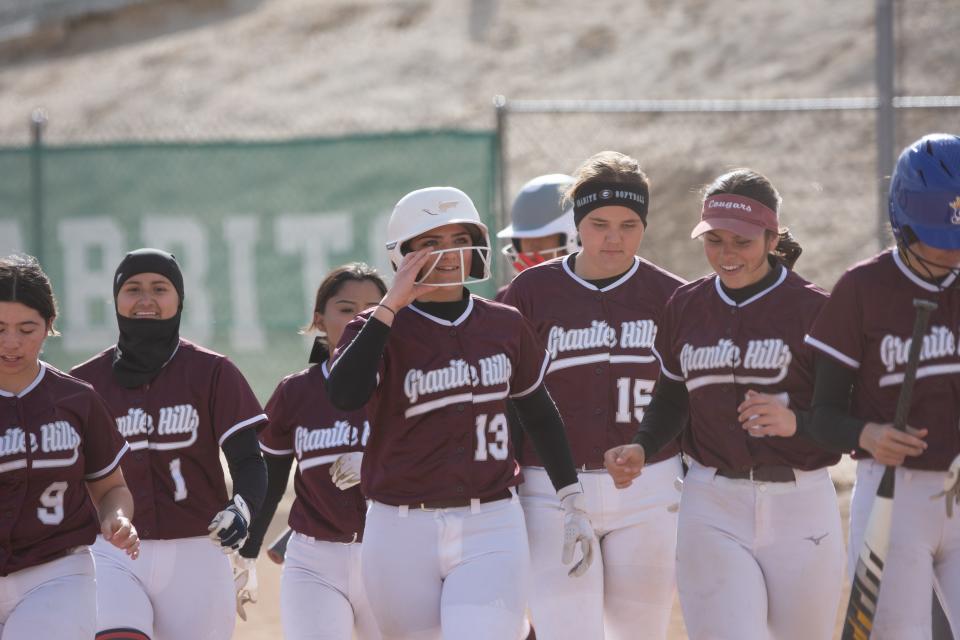 Granite Hills' Emily Marks returns to the dugout after hitting a home run during the third inning against Victor Valley on Thursday, March 14, 2024 in Victorville. Granite Hills defeated Victor Valley 20-2.