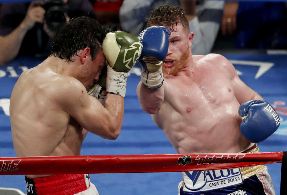 Mexican boxers Canelo Alvarez and Julio Cesar Chavez Jr. compete in their catch-weight boxing match in Las Vegas. (AP Photo/Isaac Brekken)