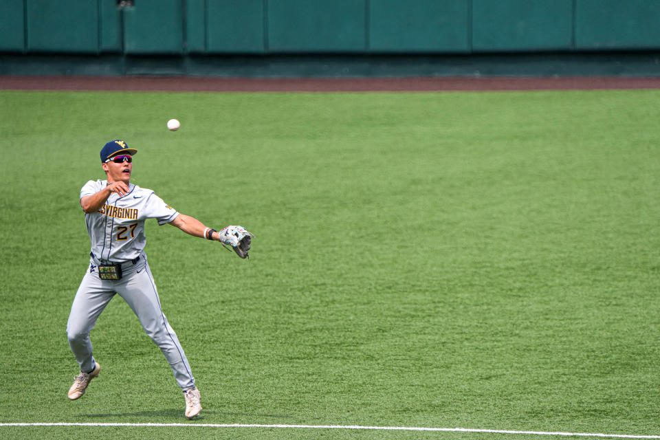 West Virginia infielder JJ Wetherholt (27) throws the ball to first during the game against the <a class="link " href="https://sports.yahoo.com/ncaaf/teams/texas/" data-i13n="sec:content-canvas;subsec:anchor_text;elm:context_link" data-ylk="slk:Texas Longhorns;sec:content-canvas;subsec:anchor_text;elm:context_link;itc:0">Texas Longhorns</a> at UFCU Disch-Falk Field on Saturday, May 20, 2023 in Austin.