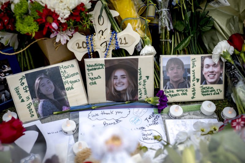 A memorial is outside of Oxford High School, days after 15-year-old student Ethan Crumbley killed four classmates before surrendering to police at Oxford, High School in Oxford, Michigan in December 2021. His parents, James and Jennifer Crumbley, are charged with involuntary manslaughter. Photo by Nic Antaya/EPA-EFE