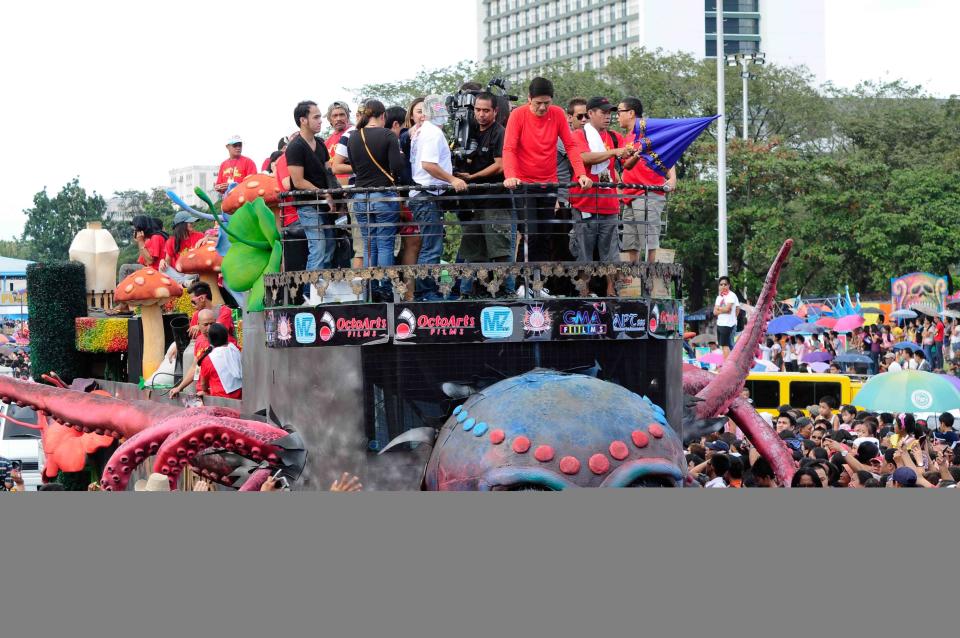 The float of the MMFF 2012 entry "Si Agimat, Si Enteng Kabisote at Si Ako" makes its way through the crowd at the 2012 Metro Manila Film Festival Parade of Stars on 23 December 2012.(Angela Galia/NPPA Images)