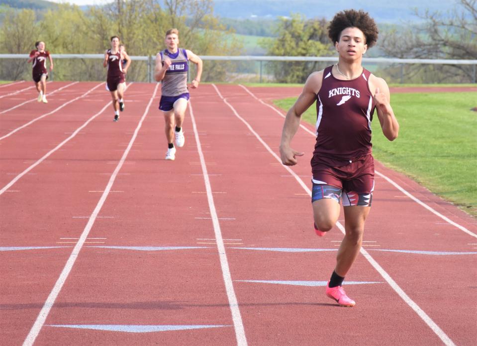 Frankfort-Schuler Maroon Knight Lionell Coulthurst (right) approaches the 400-meter finish line first Monday against Little Falls. Coulthurst also won the 100- and 200-meter races.