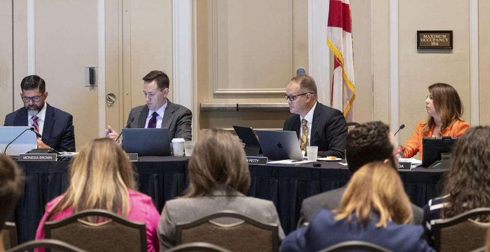 The State Board of Education members, from left to right, Manny Diaz Jr., Ben Gibson, Ryan Petty, and Kelly Garcia meet to make a decision on whether to adopt a number of rules required by new state laws in Orlando, Fla., Wednesday, July 19, 2023. (Willie J. Allen Jr./Orlando Sentinel via AP)