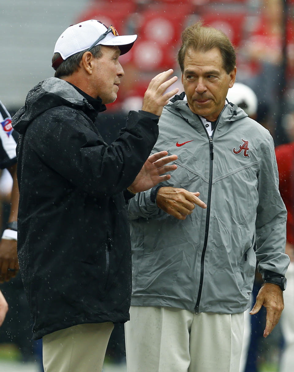 Texas A&M head coach Jimbo Fisher, left, talks with Alabama head coach Nick Saban before the first half of an NCAA college football game, Saturday, Sept. 22, 2018, in Tuscaloosa, Ala. (AP Photo/Butch Dill)