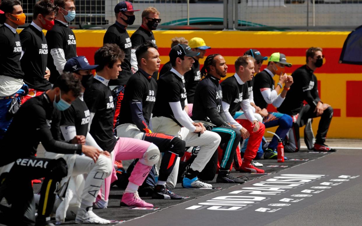 Hamilton would eventually like to see all 19 of his fellow drivers take the knee alongside him - AFP