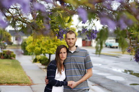 Emily and Matt Knudsen stand outside their home in Fremont, California, May 14, 2015. REUTERS/Beck Diefenbach