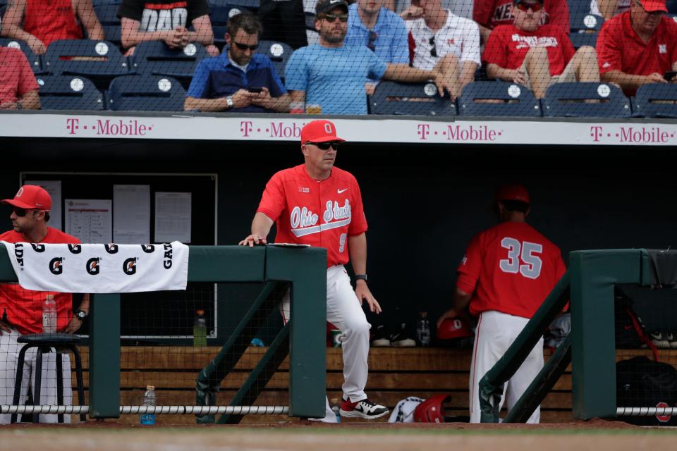 Ohio State baseball coach Greg Beals stands in the dugout at TD Ameritrade Park during the Big Ten baseball championship game May 26, 2019, in Omaha, Neb.