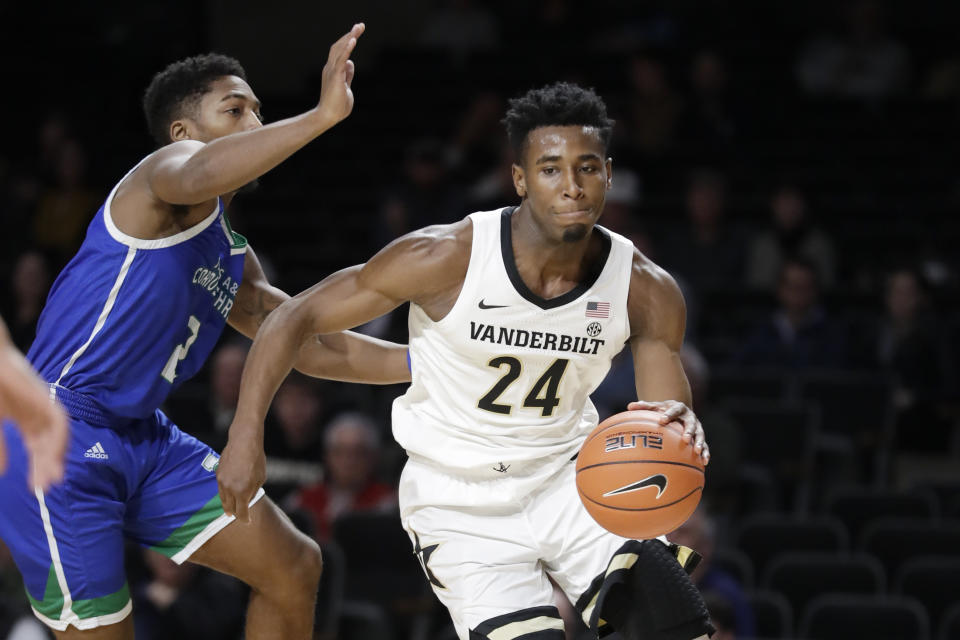 Vanderbilt forward Aaron Nesmith (24) moves past Texas A&M-Corpus Christi guard Myles Smith (2) in the first half of an NCAA college basketball game Monday, Nov. 11, 2019, in Nashville, Tenn. Nesmith led Vanderbilt with 21 points as they won 71-66. (AP Photo/Mark Humphrey)