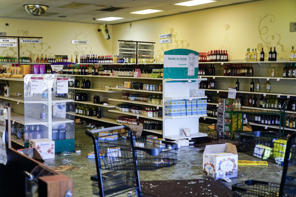 Shown is the aftermath of a ransacked liquor store in Philadelphia, Wednesday, Sept. 27, 2023. Police say groups of teenagers swarmed into stores across Philadelphia in an apparently coordinated effort, stuffed bags with merchandise and fled. (AP Photo/Matt Rourke)