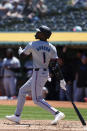 Miami Marlins' Nick Gordon watches his three-run home run against the Oakland Athletics during the first inning of a baseball game, Sunday, May 5, 2024, in Oakland, Calif. (AP Photo/Godofredo A. Vásquez)