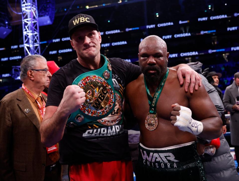 Fury and Chisora pose for a picture after their fight (Action Images/Reuters)