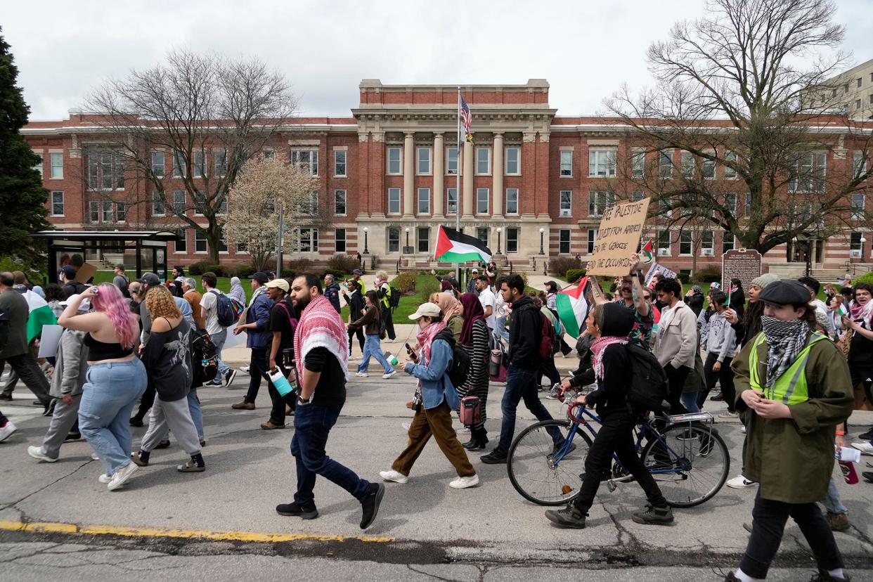 Demonstrators march as they protest the Israel-Hamas war on the University of Wisconsin-Milwaukee campus in Milwaukee on Monday.