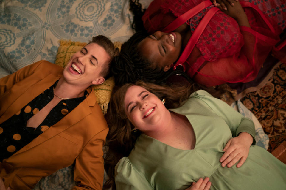 E.R. Fightmaster as Em, Aidy Bryant as Annie, and Lolly Adefope as Fran lie on the ground and laugh in "Shrill"