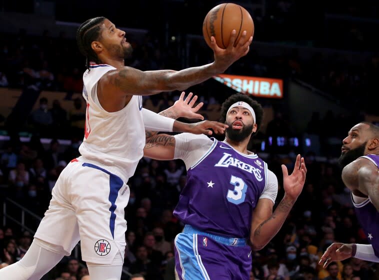 LOS ANGELES, CALIF. - DEC. 3, 2021. Clippers forward Paul George goes to the basket.