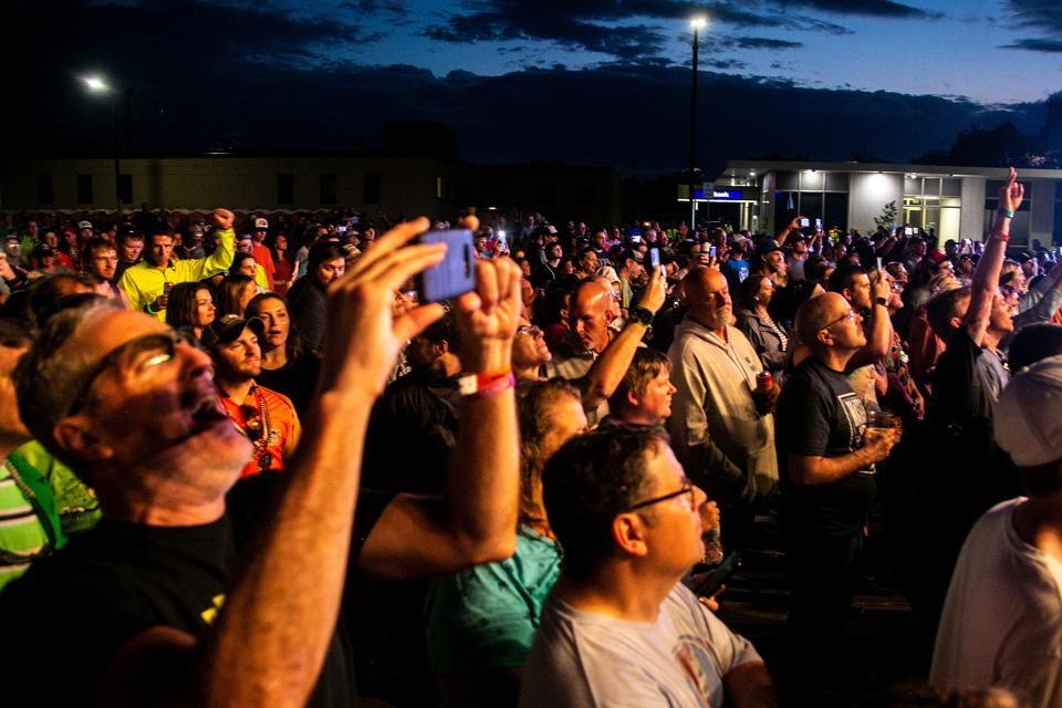 People cheer as Sugar Ray performs during the fourth day of RAGBRAI, Wednesday, July 27, 2022, in Mason City, Iowa.