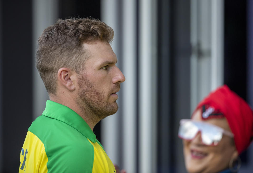 Australia's captain Aaron Finch walks back to the players pavilion at the end of the 2nd T20 cricket match between South Africa and Australia at St George's Park in Port Elizabeth, South Africa, Sunday, Feb. 23, 2020. South Africa beat Australia by 12 runs. (AP Photo/Themba Hadebe)