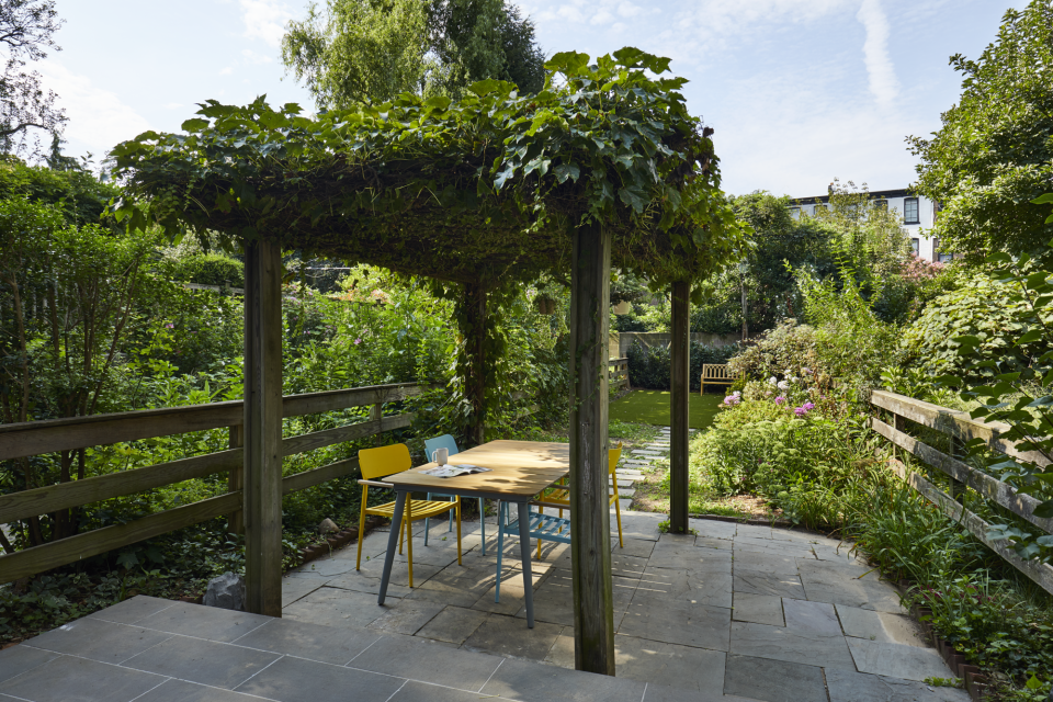 An outdoor space with a dining table