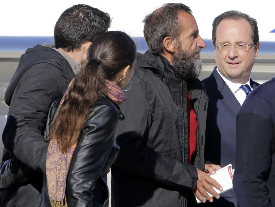 Freed French hostages arrive home