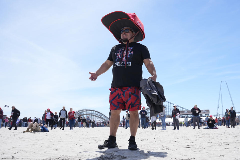 Anthony Pahopin wears an over-sized Donald Trump cap before a campaign rally for Republican presidential candidate former President Trump in Wildwood, N.J., Saturday, May 11, 2024. (AP Photo/Matt Rourke)