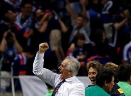 Football Soccer - Japan v Iraq - World Cup 2018 Qualifier - Saitama Stadium 2002, Saitama, Japan - 6/10/16. Japan's head coach Vahid Halilhodzic (L) celebrates with his team members after Japan's Hotaru Yamaguchi scored the second goal for Japan against Iraq. REUTERS/Issei Kato