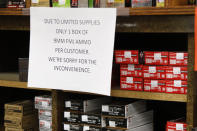 FILE - In this Wednesday, March 25, 2020, file photo, signs point out quantity limits on certain types of ammunition after Dukes Sport Shop reopened, in New Castle, Pa. After a year of pandemic lockdowns, mass shootings are back, but the guns never went away. As the U.S. inches toward a post-pandemic future, guns are arguably more present in the American psyche and more deeply embedded in American discourse than ever before. The past year's anxiety and loss fueled a rise in gun ownership across political and socio-economic lines. (AP Photo/Keith Srakocic, File)