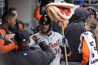 Detroit Tigers' Jake Rogers celebrates with teammates after hitting a solo home run during the fifth inning of a baseball game against the Chicago White Sox in Chicago, Sunday, March 31, 2024. (AP Photo/Nam Y. Huh)