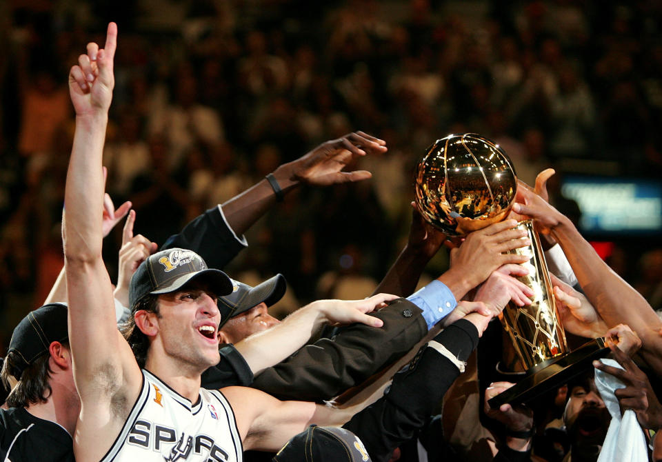 Manu Ginobili celebrates the 2005 NBA championship, his second of four titles with the San Antonio Spurs.  (Ronald Martinez/Getty Images)