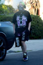 <p>Billie Eilish wears a skeleton-print face covering as she takes her recently-adopted foster puppy for a walk in Los Angeles on Thursday.</p>