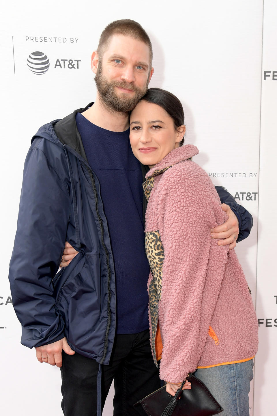 the couple hugging each other at an event