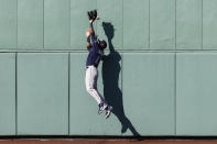 Tampa Bay Rays' Manuel Margot cannot get a triple off the wall by Boston Red Sox's Taylor Motter during the sixth inning of a baseball game Monday, Sept. 6, 2021, at Fenway Park in Boston. (AP Photo/Winslow Townson)