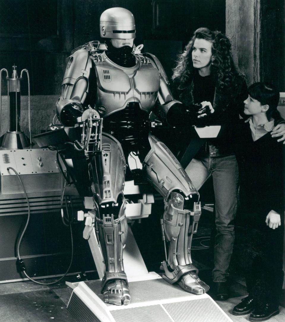 Lisa Madigan (Yvette Nipar) and Gadget (Sarah Campbell) look on at Alex Murphy (Richard Eden) in "Robocop: The Series" from 1994.