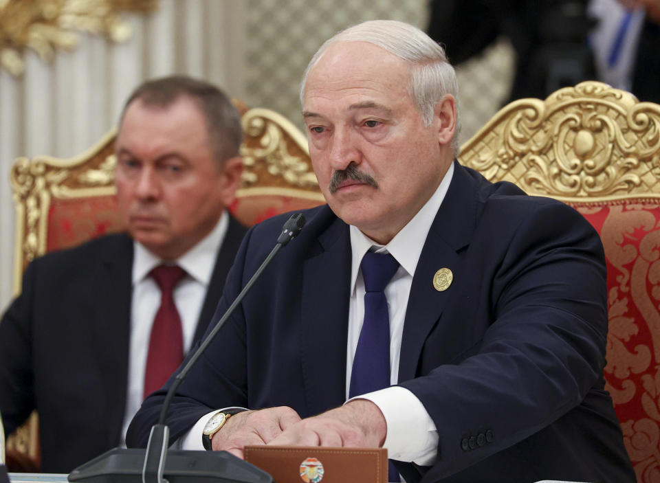 FILE - In this photo released by the Russian Foreign Ministry Press Service, Belarusian President Alexander Lukashenko, and Belarusian Foreign Minister Vladimir Makei, left, attend the meeting of the Collective Security Treaty Organization (CSTO), in Dushanbe, Tajikistan, Thursday, Sept. 16, 2021. Belarusian Foreign Minister Vladimir Makei, a close ally of authoritarian President Alexander Lukashenko, has died at age 64, the state news agency Belta reported Saturday, Nov. 26, 2022. No cause of death was stated. (Russian Foreign Ministry Press Service via AP, File)