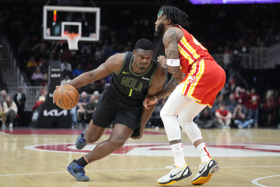 New Orleans Pelicans forward Zion Williamson (1) drives against Atlanta Hawks forward Saddiq Bey (41) during the first half of an NBA basketball game Sunday, March 10, 2024, in Atlanta. (AP Photo/John Bazemore)