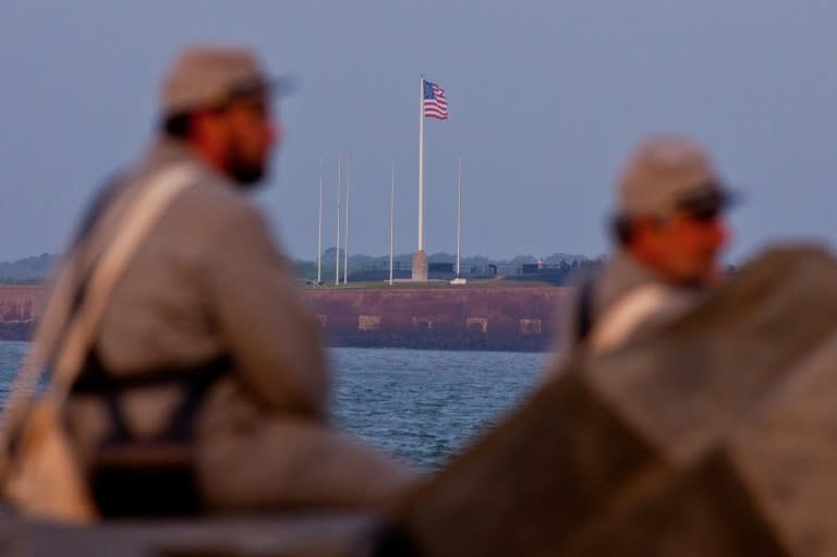 Confederate soldier re-enactors look out at Fort Sumter in Charleston Harbor, from positions in Fort Moultrie early on April 12, 2011 in Charleston, South Carolina, an area that could be in the path of Hurricane Florence in September 2018