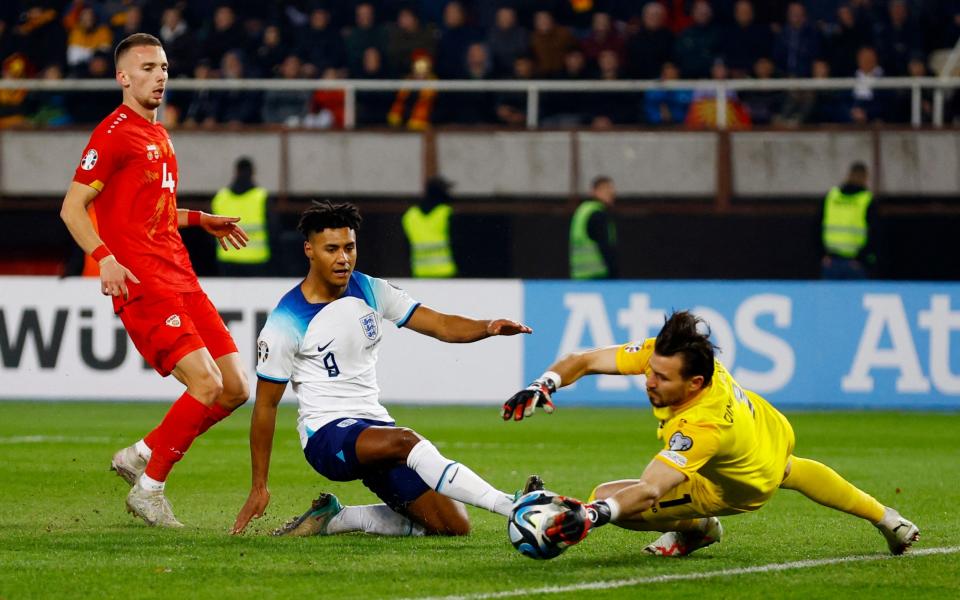 England's Ollie Watkins in action with North Macedonia's Stole Dimitrievski and Nikola Serafimov