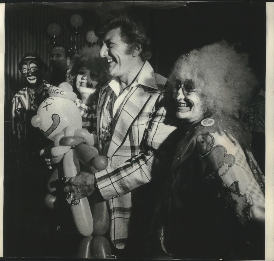 Liberace, shown at a 1978 news conference to announce plans for a Liberace museum in Wauwatosa, appeared on "Saturday Night Live" in 1985.