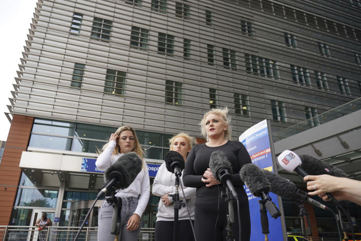The mother of Archie Battersbee, Hollie Dance, right, speaks to the media outside the Royal London hospital in Whitechapel, east London, Wednesday Aug. 3, 2022. Archie Battersbee, 12, was found unconscious at home with a ligature over his head on April 7, and been in coma since then. His family, at the center of a life-support battle, says it has appealed to the European Court of Human Rights in a last-ditch bid to stop a hospital ending his treatment. (Dominic Lipinski/PA via AP)