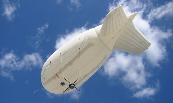 Raven Industries Aerostat blimp in the sky as seen from below.