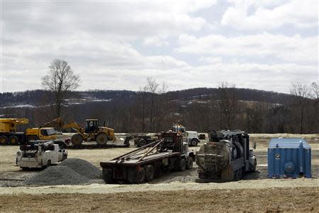 Truck are seen on a field of Cabot Oil & Gas Co. near Montrose, in Pennsylvania, March 24, 2014. REUTERS/Eduardo Munoz