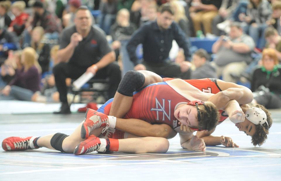 Zane Trace's Zane Pickerrell during a match in the Division III district tournament at Harrison Central High School on Saturday.