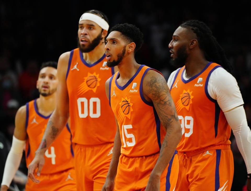 Dec 10, 2021; Phoenix, AZ, United States; Suns' Landry Shamet (L-R), JaVale McGee, Cam Payne and Jae Crowder wait for the Celtics inbound during the second half at the Footprint Center.