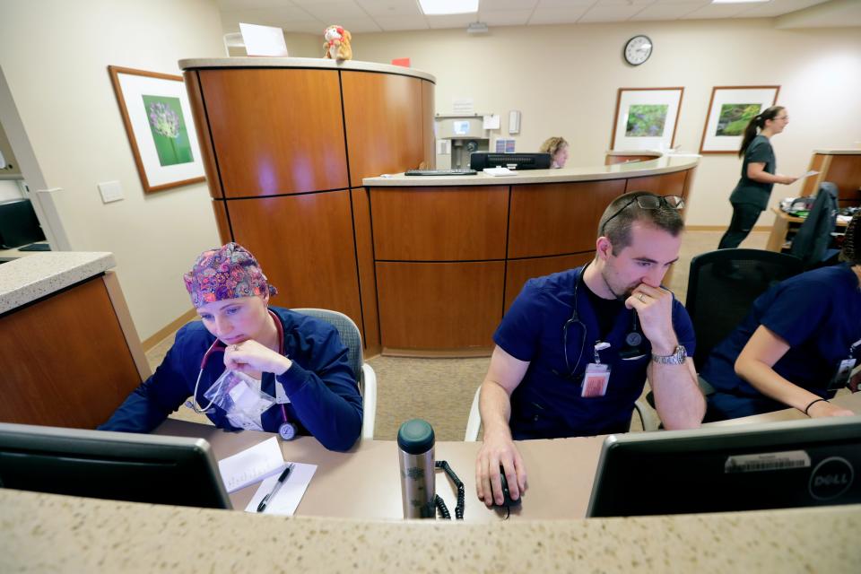 Hannah Pecora, RN, left, and Christopher Johnson, RN, work a shift together at SSM St. Agnes Hospital in Fond du Lac.