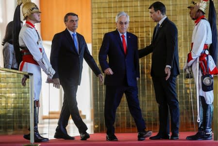 Brazil's President Jair Bolsonaro and Chile's President Sebastian Pinera are seen before a news conference at the Alvorada Palace in Brasilia