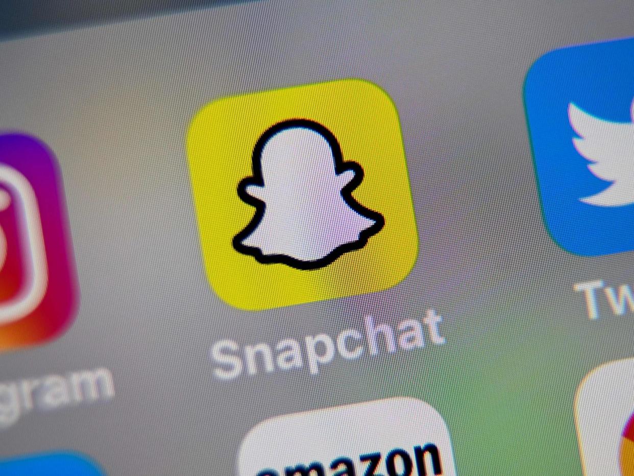 Snapchat logo displayed on a tablet: (AFP)